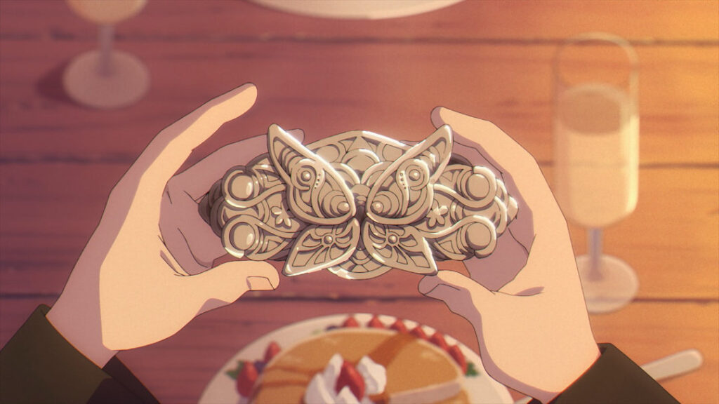 Fern's metal hairpin with the shape of a butterfly in it.